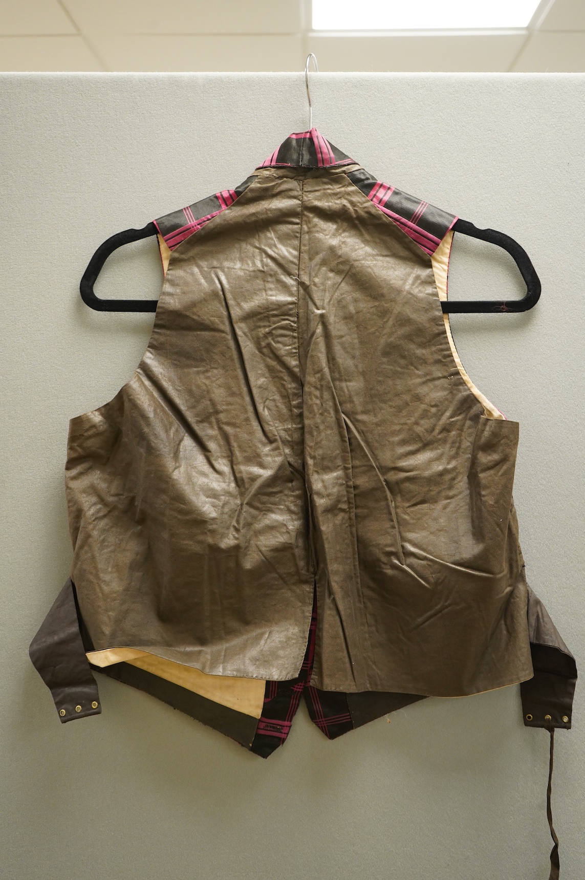 A 19th century gentleman's pink and black silk check waistcoat, with collar and two pockets. Front under arm chest 50cm. Condition - lining stained may need professional cleaning.